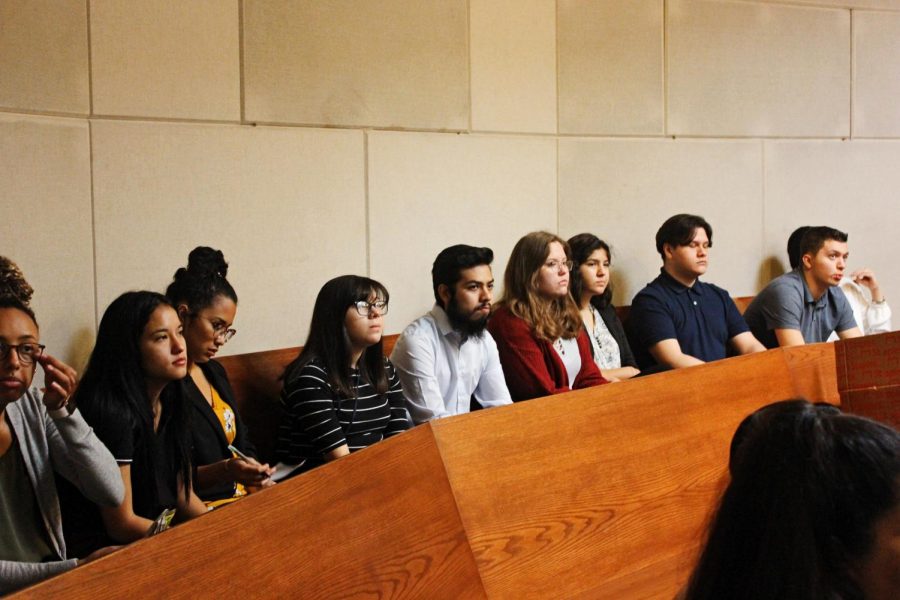 Students in the Austin Corps class listen to municipal court judge staff during a field trip in downtown Austin.