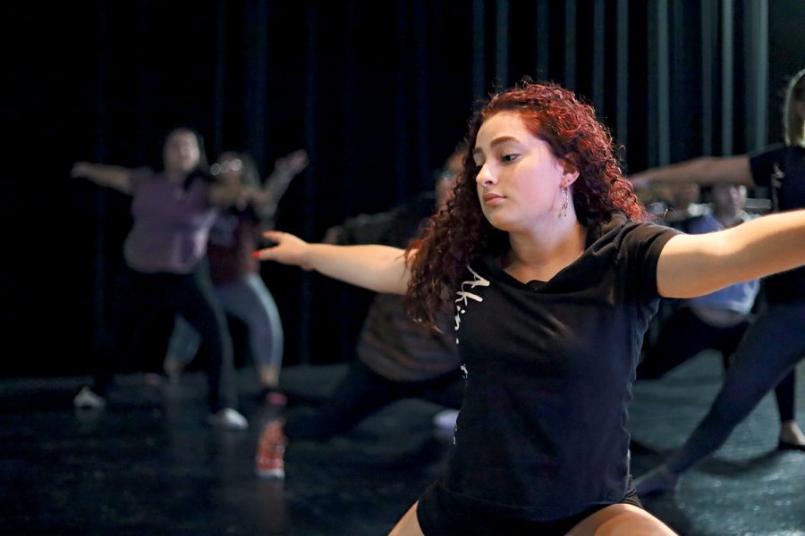 Junior Julia Creed assumes the warrior pose along with the rest of her class. A new yoga class could be coming in the 2020 fall semester headed up by current Aerobic dance teacher Morgan Eddy.