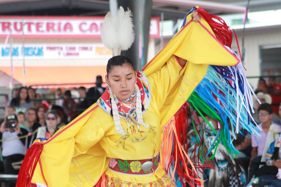 Fancy Dancer dancing to the beat of a Pow Wow drum during the celebration