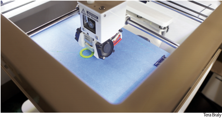 Mr. Sayces 3D Printer starts to form the base of a ring. The
machine spent minutes to warm up before working on the object.