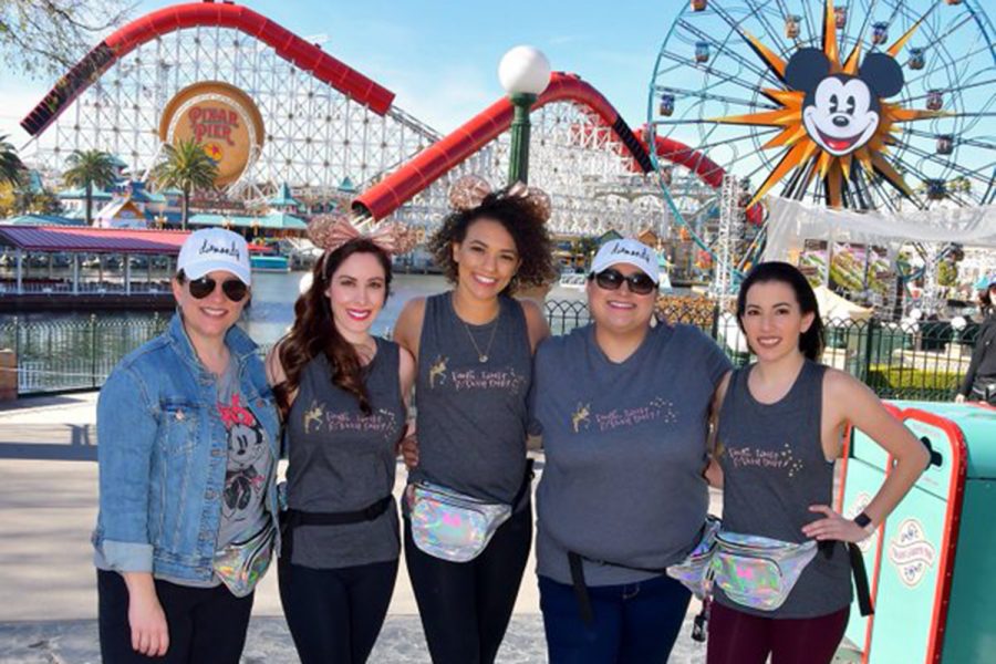 Diamond Dazzler dance instructor Ally Gates (right) poses for a shot with Akins staff on a student trip to Disneyland. Starting this fall, Jordyn Marsh (center) will take over as the new head dance director.
