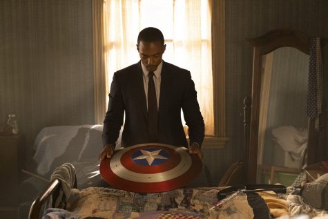 Sam Wilson is looking at the Captain America shield that was given to him by Steve Rogers at the end of Endgame. Sam will take the shield to the U.S. government to have it as a memorial.