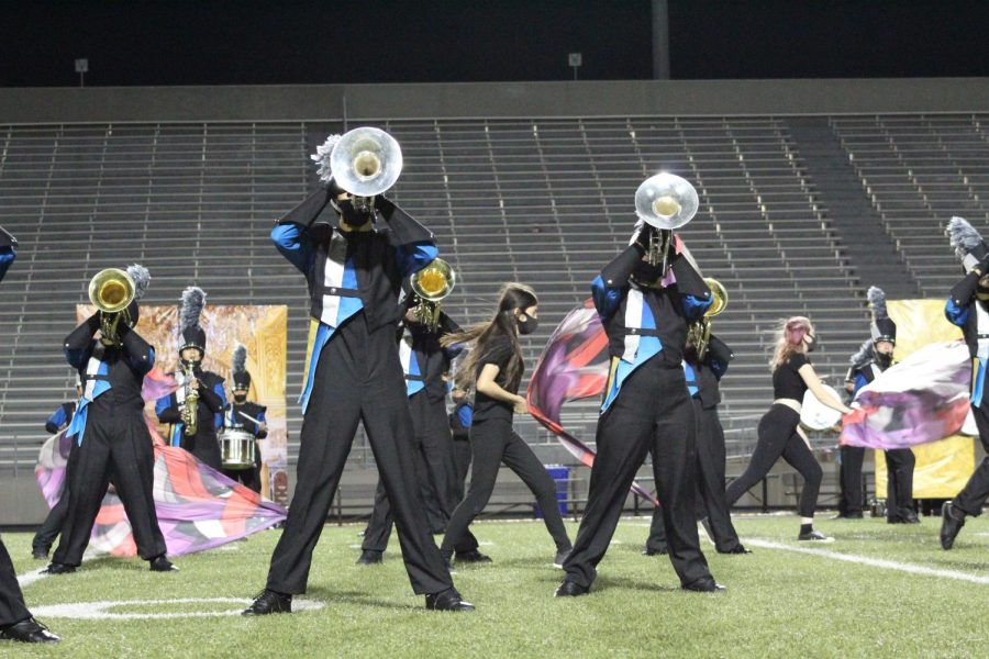 The Akins Marching Band performs on the night of the Homecoming Game. 
