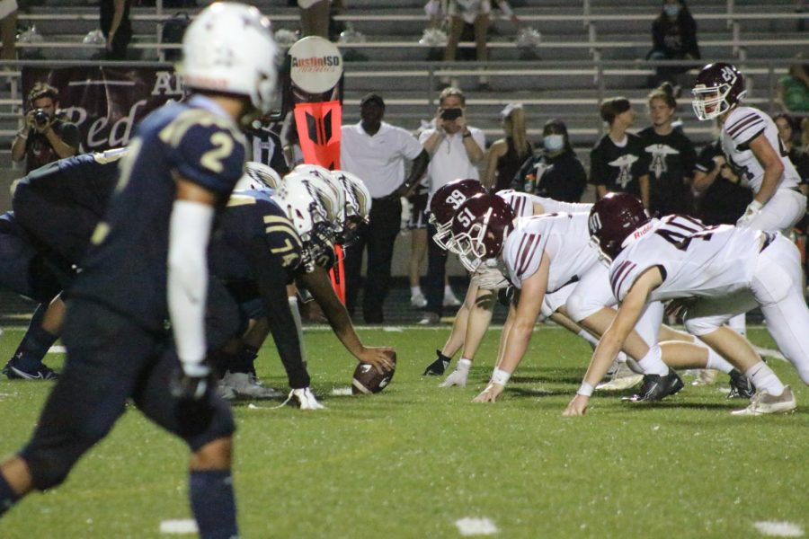 Akins battles Austin High on the night of the Homecoming Game.