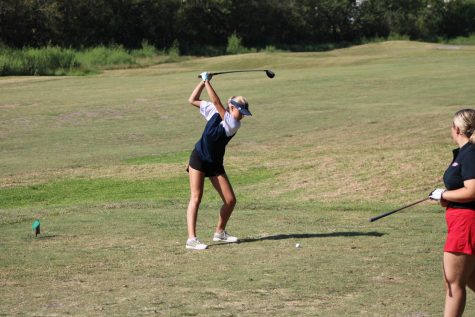 Senior golfer Riley Romero winds up before hitting the ball at a  tournament at the Shadow Glen Golf Course in Manor.