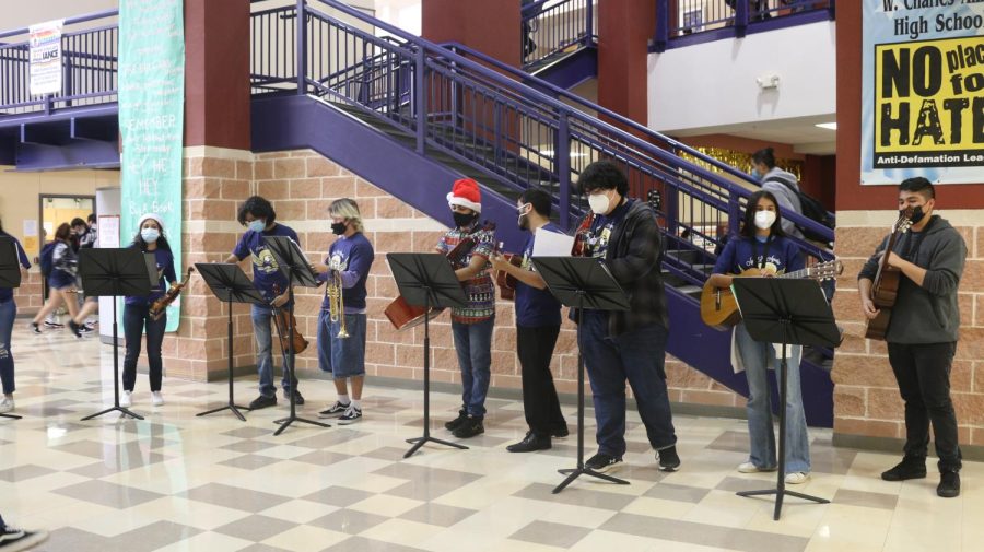 Akins Fine Arts programs perform holiday music in the foyer in early December.