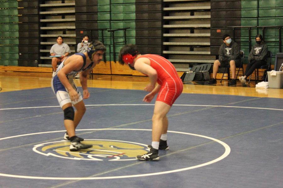 Junior Noah Ortiz faces an opponent from Canyon High School in a home game match in January.