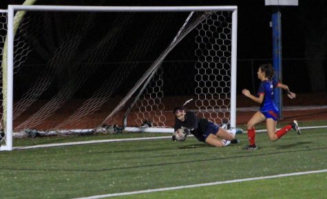 Goalie Marlen Hernandez makes a save in the girls varsity soccer teams game against Hays Hawks in January
