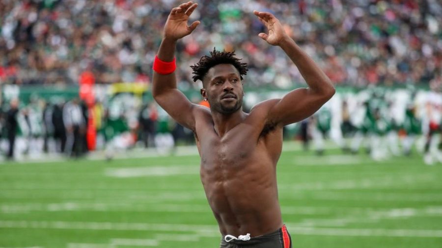 Antonio Brown takes off his equipment and throws it into the stands as he runs off the field in a game against the New York Jets