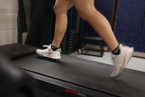 An Akins athlete runs on a treadmill in the athletic trainers office to test their heart and lung performance for the Return-to-Play Protocol that is used to determine if they are ready to return to competitive sports after having a COVID-19 infection.