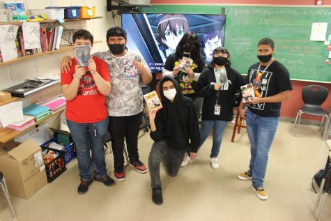 Members of the Akins Anime Club show off copies of some of their favorite Manga comic books during an after school meeting. The club meets in RM 239 on Tuesdays and in the library on Thursdays.