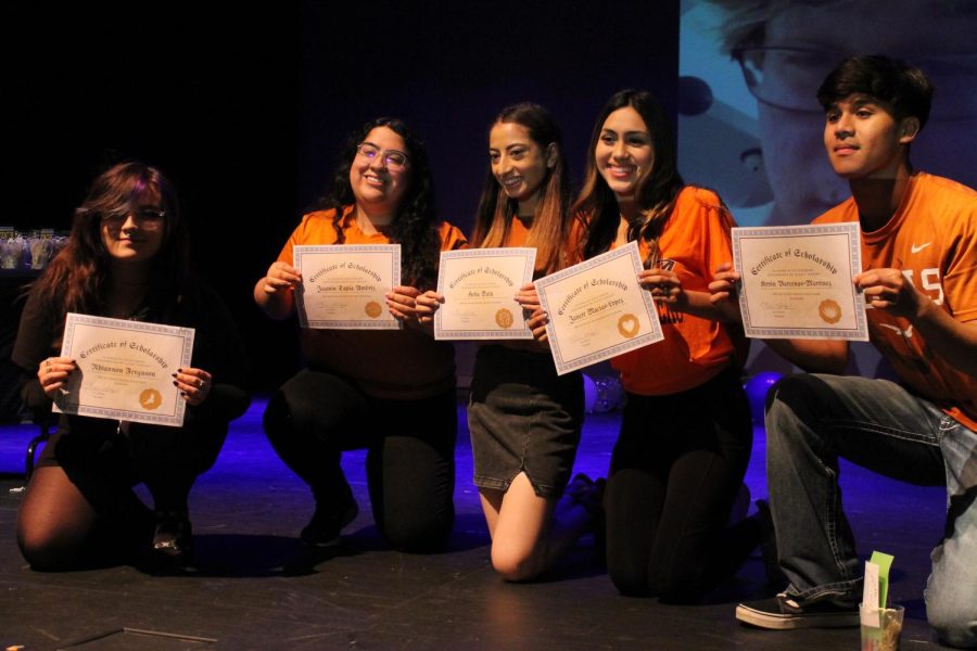 Students who received the Christy Scholarship line up on stage.