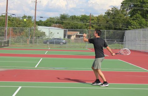 Egan Lutz, gets ready to serve the ball back toward the opposing players on Croceketts tennis team