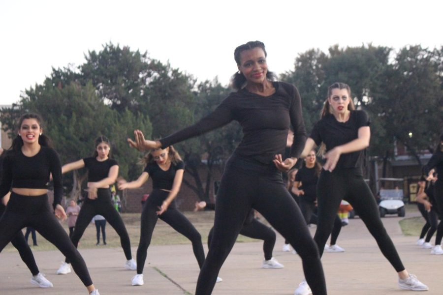 The Akins Diamond Dazzlers perform to the public as an opening sequence.