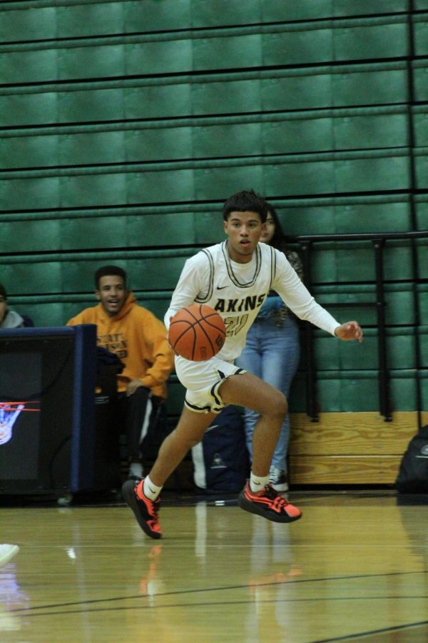 Roman Trevino,  makes a break for it, dribbling the ball during the Navarro game shortly before making a shot.