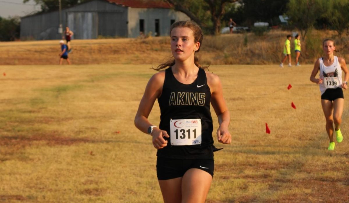 Junior Ava Linnell runs in the Westlake Chaparral Invitational on Aug. 25 at the Southeast Metro Park. She placed 10th at the Invitational being their first meet of the season.