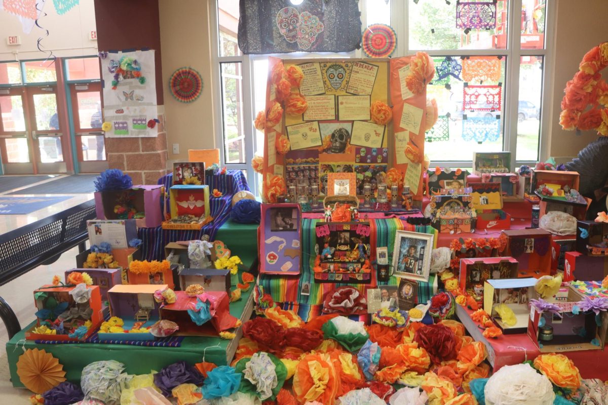 Miniature-sized ofrendas made by students in Spanish classes are on display at the front of the school as part of a Hispanic culture project.
