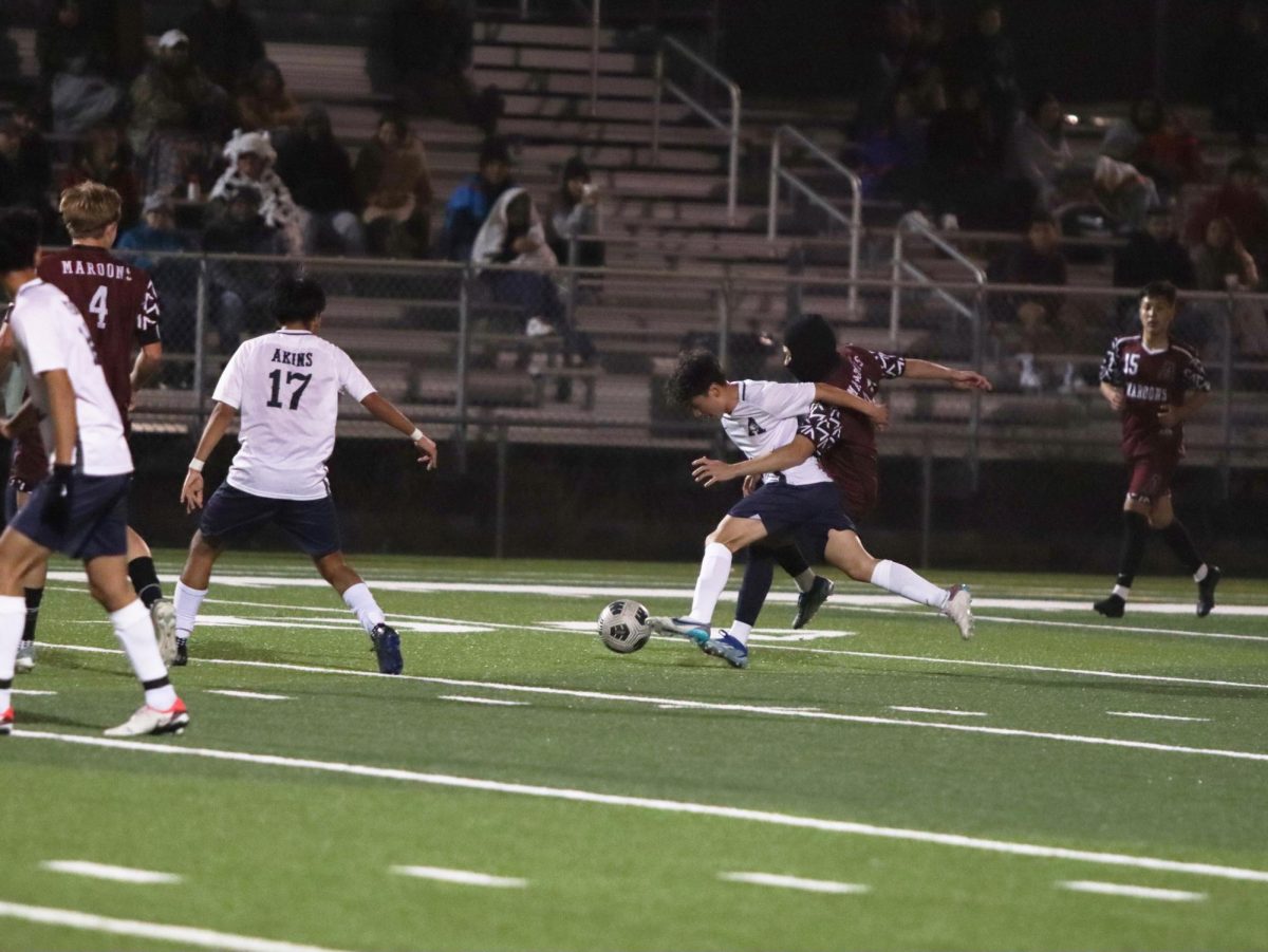 Giving it his all
Yomar Olvera stealing the ball from the oppositing team at the Austin High VS Akins Boys Soccer match.
