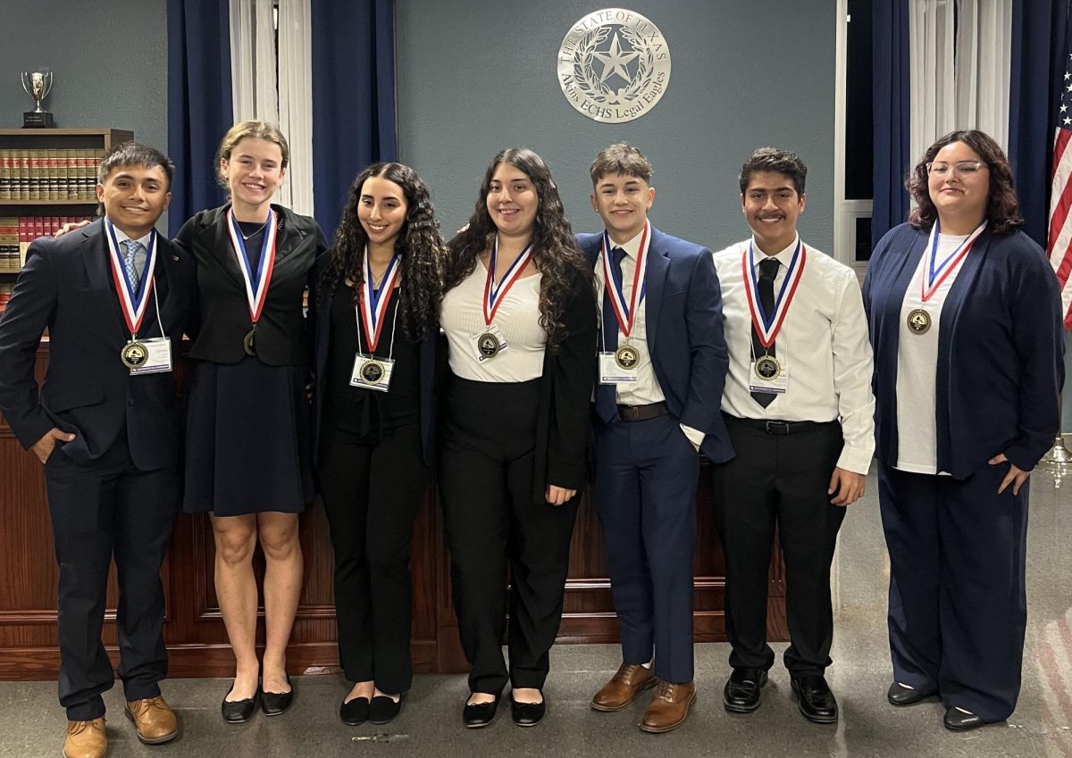 The senior Akins mock trial team shows off their medals after winning second place in their YMCA Youth and Government competition. The team will advance to compete at the state competition. 