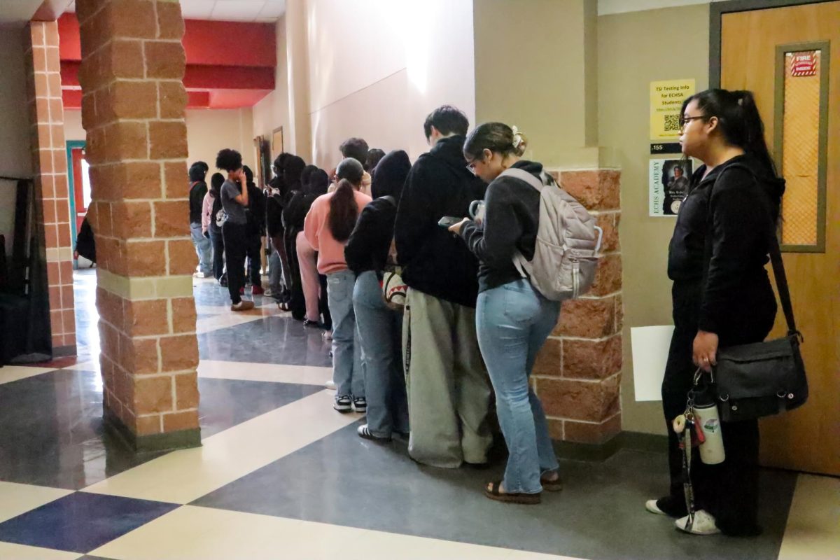 Students stand in line to get a tardy pass during 5th Period because they were late to class. Lines have been long after administrators started enforcing the new tardy policy in January.