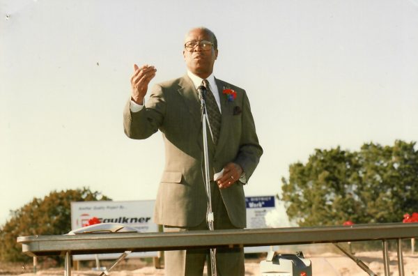 Dr. W. Charles Akins speaks at the groundbreaking ceremony for the constructing of Akins High School in January 1999. Courtesy Akins Archive 