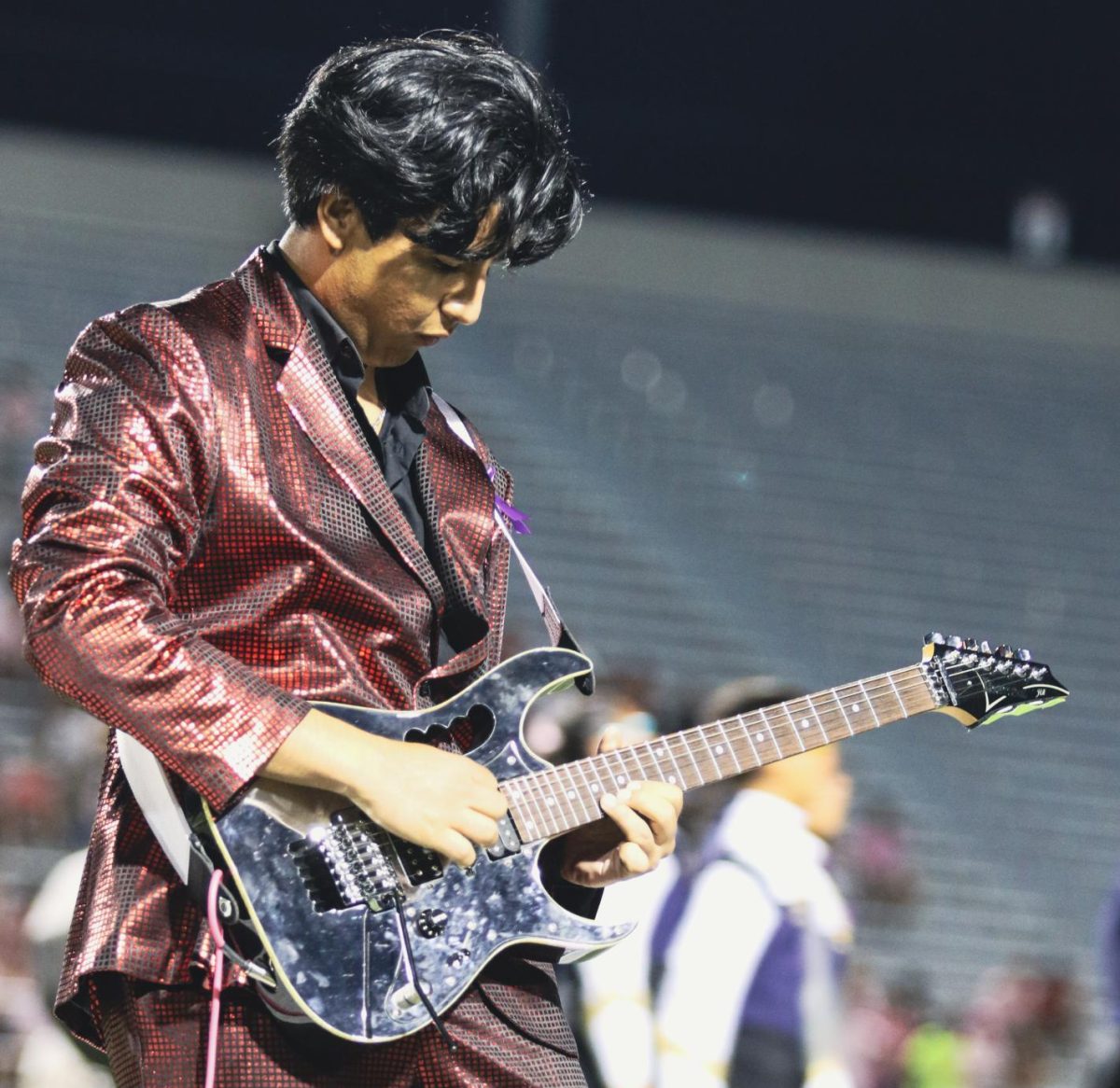 Junior Sam Martinez plays a version of Metallica's "Master of Puppets" during the Akins Eagles Band's halftime show.